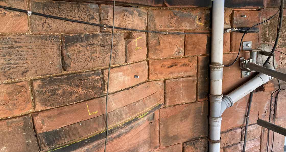 North elevation: stone work was in a poor state of repair. All cement pointing raked out, and stones marked up for indents or Lithomex repair