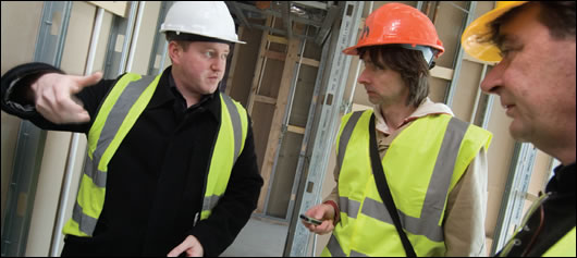 Diarmuid Hynes (left) and David Heffernan, founder of HAA (right) explaining the intricacies of the building to Construct Ireland's John Hearne (centre)