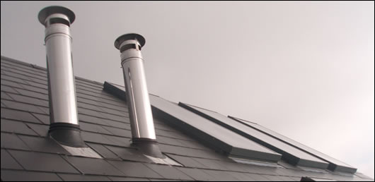 The insulated flue, supplied by Schiedel Chimney Systems, is brought through the house and terminates at a high level over the roof, ensuring that the flue will work well and that the residents should not experience bad odours outside the house The insulated flue, supplied by Schiedel Chimney Systems, is brought through the house and terminates at a high level over the roof, ensuring that the flue will work well and that the residents should not experience bad odours outside the house
