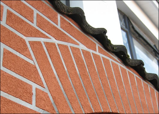 A terrace in North Dublin (below) where three householders externally insulated with a brick-like render finish (above) to base and a napp finish render A terrace in North Dublin (below) where three householders externally insulated with a brick-like render finish (above) to base and a napp finish render