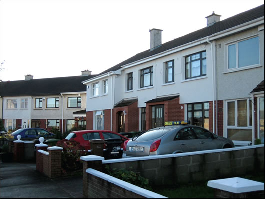 A terrace in North Dublin (below) where three householders externally insulated with a brick-like render finish (above) to base and a napp finish render A terrace in North Dublin (below) where three householders externally insulated with a brick-like render finish (above) to base and a napp finish render