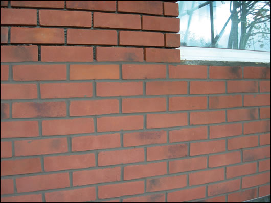 (below and above) Ibstock’s Brickshield system, with Rockwool high density external insulation coated in the company’s adhesive mortar, before Ibstock brick slips are applied (below and above) Ibstock’s Brickshield system, with Rockwool high density external insulation coated in the company’s adhesive mortar, before Ibstock brick slips are applied