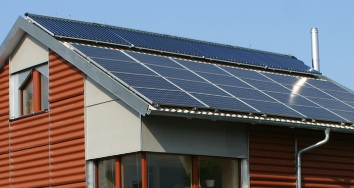 A solar photovoltaic array-clad passive house, a site that may become more familiar due to the Passive House Institute's new certification system